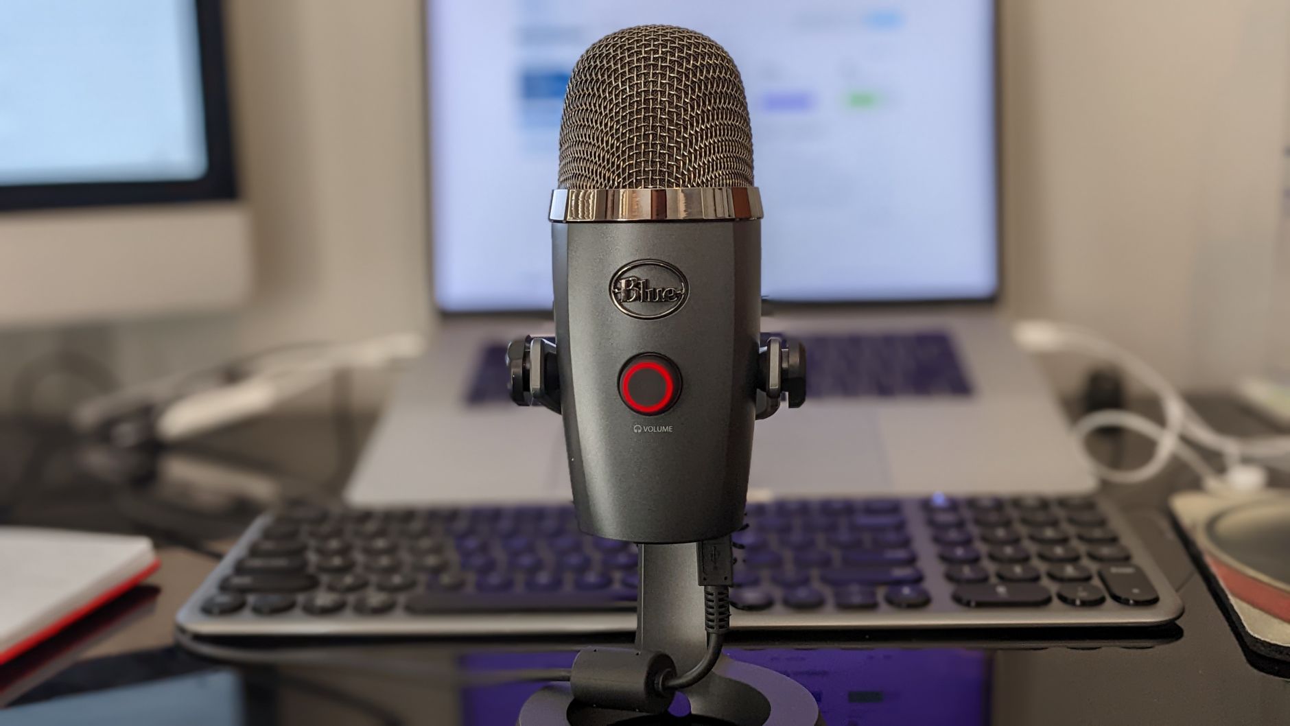 Professional audio recording equipment and a laptop in a news studio